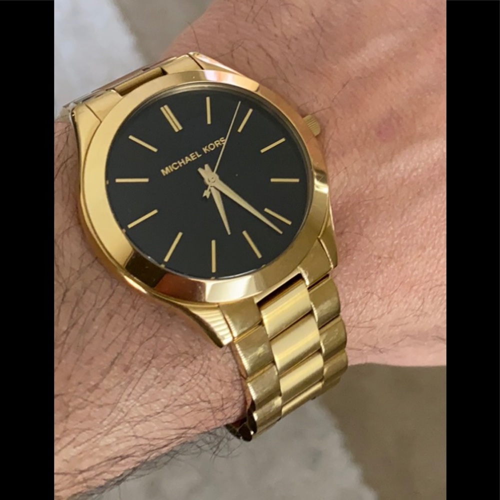 Gold watch with black dial